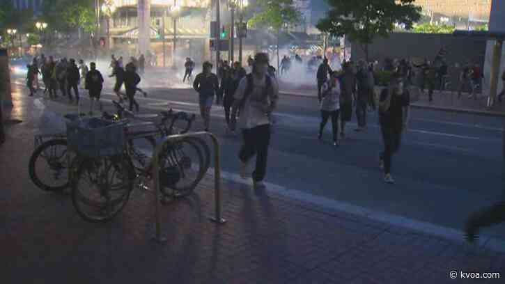 Protesters light small fire near Portland police precinct