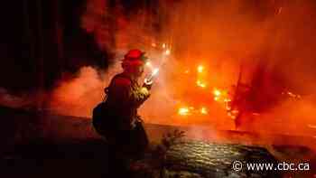 As California burns, the winds arrive and the lights go out