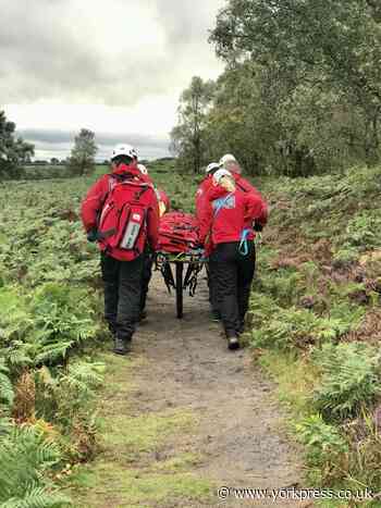 Mountain rescue team help injured woman