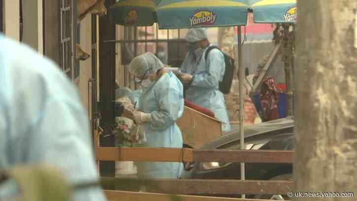 Peruvian health workers test residents door-to-door in Lima suburb