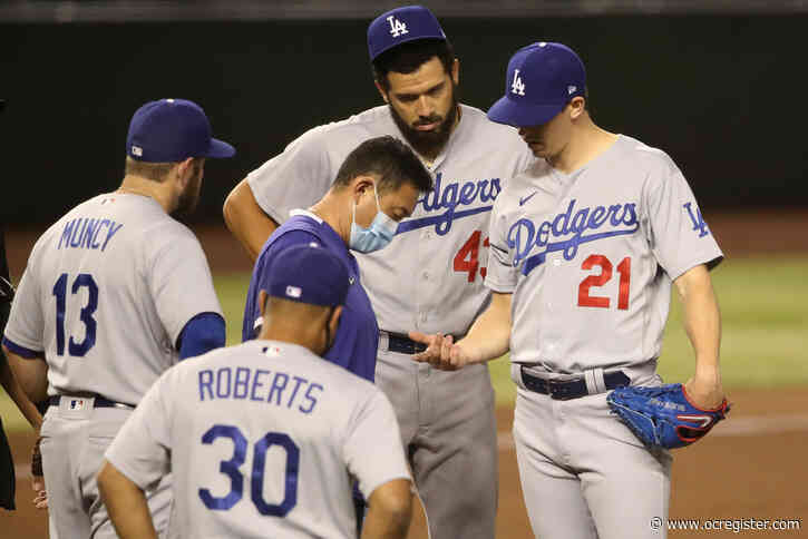 Dodgers absorb short start by Walker Buehler, win a wild one in extra innings