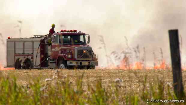 Grass fire in farmer's field in northeast Calgary erupts twice