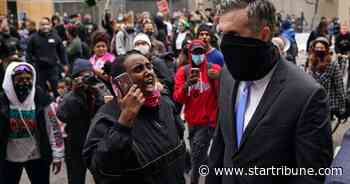 Protesters confront former Minneapolis police officers with shouts of 'murderer'