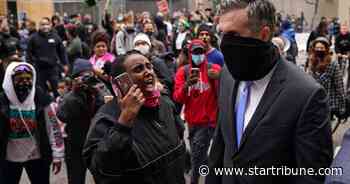 Crowd swarms former Minneapolis police officers with shouts of 'Murderer!'