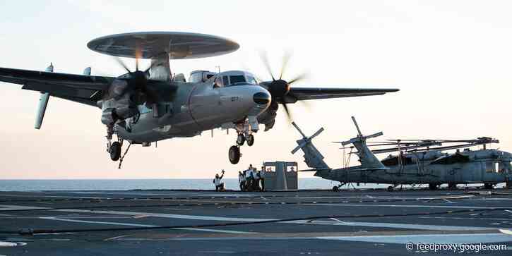 A Navy early-warning plane was damaged after hitting a fighter jet while landing on an aircraft carrier