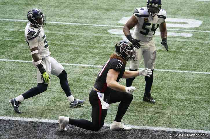 Wilson throws 4 TD passes, Seahawks beat Falcons 38-25