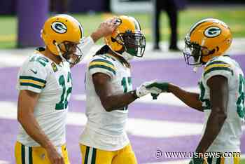 Rodgers at Ease as Packers Roll Past Vikings 43-34