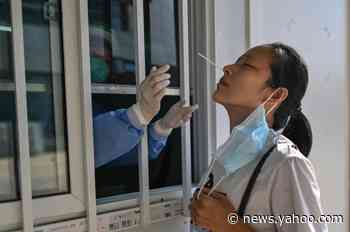 US eases China travel warning, citing virus progress