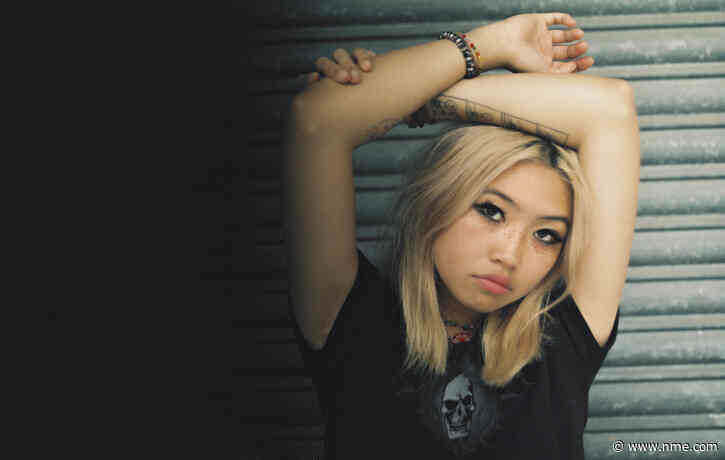 Watch Beabadoobee rock out in a hotel room for new ‘Worth It’ video
