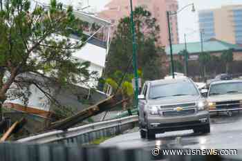 The Latest: Big Trees Down, Creeks Overflowing in Florida