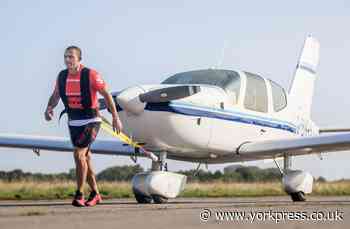 Kickboxer's bid to do a marathon - while pulling an aeroplane