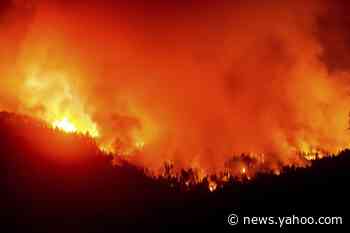 Latest: Southern California forest fire burns near homes