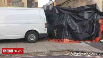 Banksy's gorilla in a pink mask removed from Bristol wall