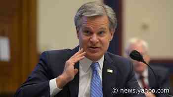 Russia working to help reelect President Trump, FBI chief says