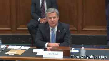 Russia trying to interfere in the 2020 election, denigrate Biden, FBI director says