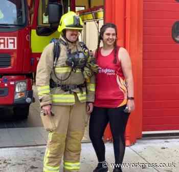 Firefighter takes on half marathon in full gear for charity