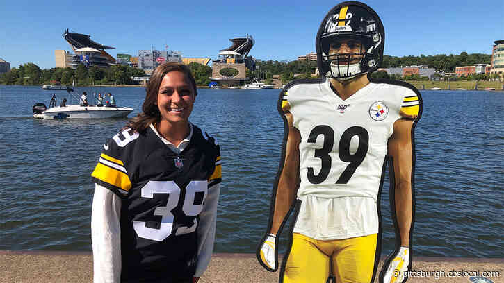 Steelers Fans Pose With Lifesize Cutouts Of Players