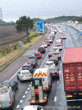 M62 westbound closed by crane fire and fuel spillage