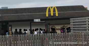 People pictured 'breaking' social distancing rules outside McDonald's