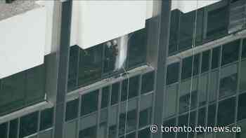 Window washers rescued from Toronto skyscraper ledge after platform falls hundreds of feet