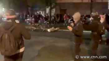 Police officer put on leave for riding bicycle over protester's head