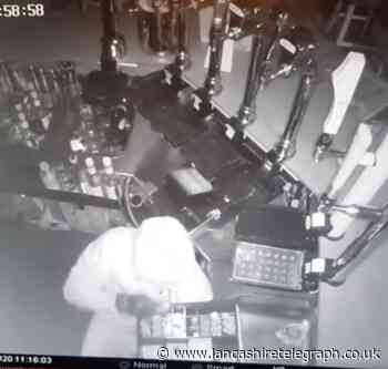 Brazen thief caught on CCTV launching brick through bar window before stealing £1,400 from till