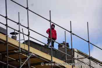 Man on rooftop brings part of Blackburn town centre to standstill