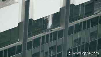 Two window washers rescued from ledge atop Toronto skyscraper, after platform fell hundreds of feet - CP24 Toronto's Breaking News