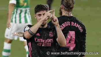 Real Madrid battle to victory over 10-man Real Betis