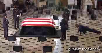 Ruth Bader Ginsburg’s trainer does pushups next to her casket in the Capitol