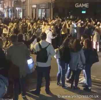 Video shows rowdy crowds packing city centre streets