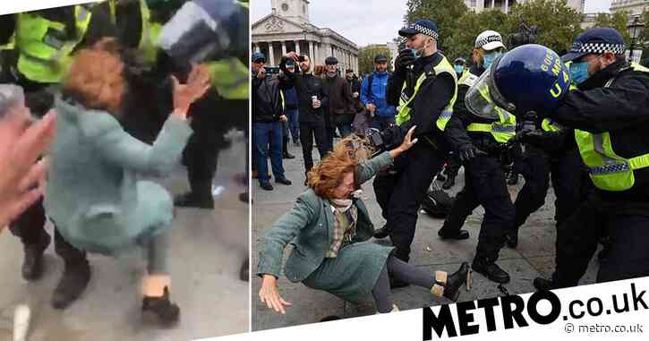 Maskless woman shoved to ground in clashes with police at anti-lockdown protest