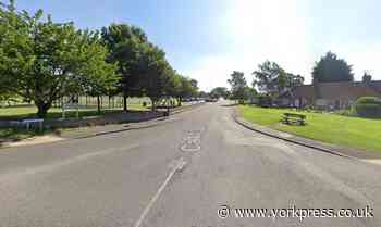 Firefighters free person from vehicle on its side after crash in Haxby
