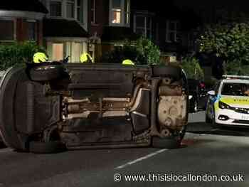Car overturned in crash by suspected drink driver at Finchley Central