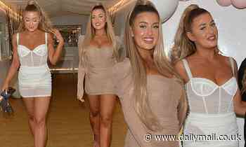 Reality twins Eve and Jess Gale pour their curves into busty mini-dresses