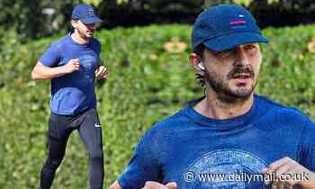 Shia LaBeouf blows off steam during daily jog... after being 'charged with battery and petty theft'