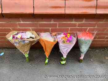 Floral tributes left outside Reedley home where mother and daughter were killed