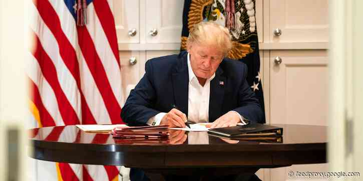 The White House released photos of Trump working in hospital that critics say appears to be a publicity stunt