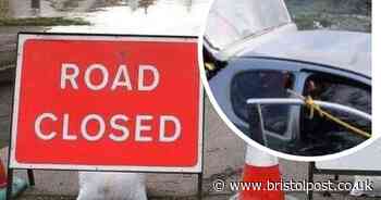 Driver forced to climb on car roof after driving into flood water