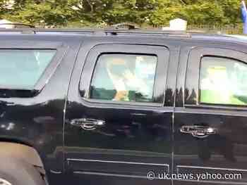 Trump leaves hospital suite to wave to supporters from motorcade