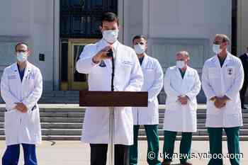 Trump news - live: President greets supporters outside hospital after reports of White House return on Monday