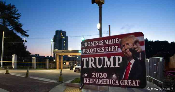 Trump leaves hospital briefly to greet supporters outside