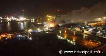 Drone footage shows overnight work on ongoing docks fire