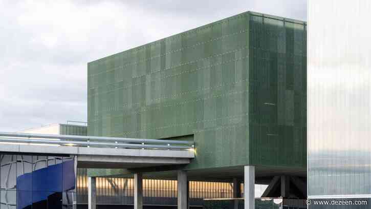 MEETT exhibition centre by OMA features perforated green facade