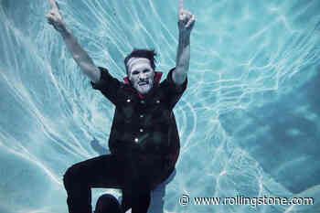Mike Viola Is a Pool-Lazing Vampire in ‘Drug Rug’ Video, Featuring Mandy Moore
