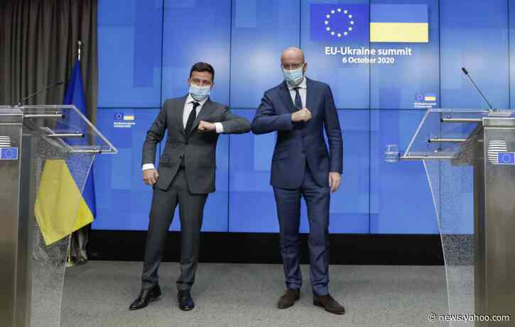 EU to boost Ukraine ties, urges Russia to honor peace deal