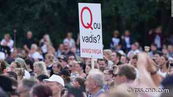 How the 'parasite' QAnon conspiracy cult went global