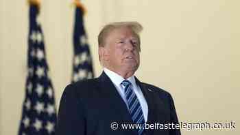 Trump remains out of sight as doctor says he is symptom-free