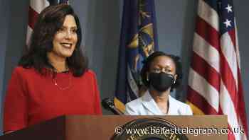 13 charged in plots against Michigan government