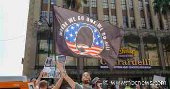 Facebook bans QAnon across its platforms